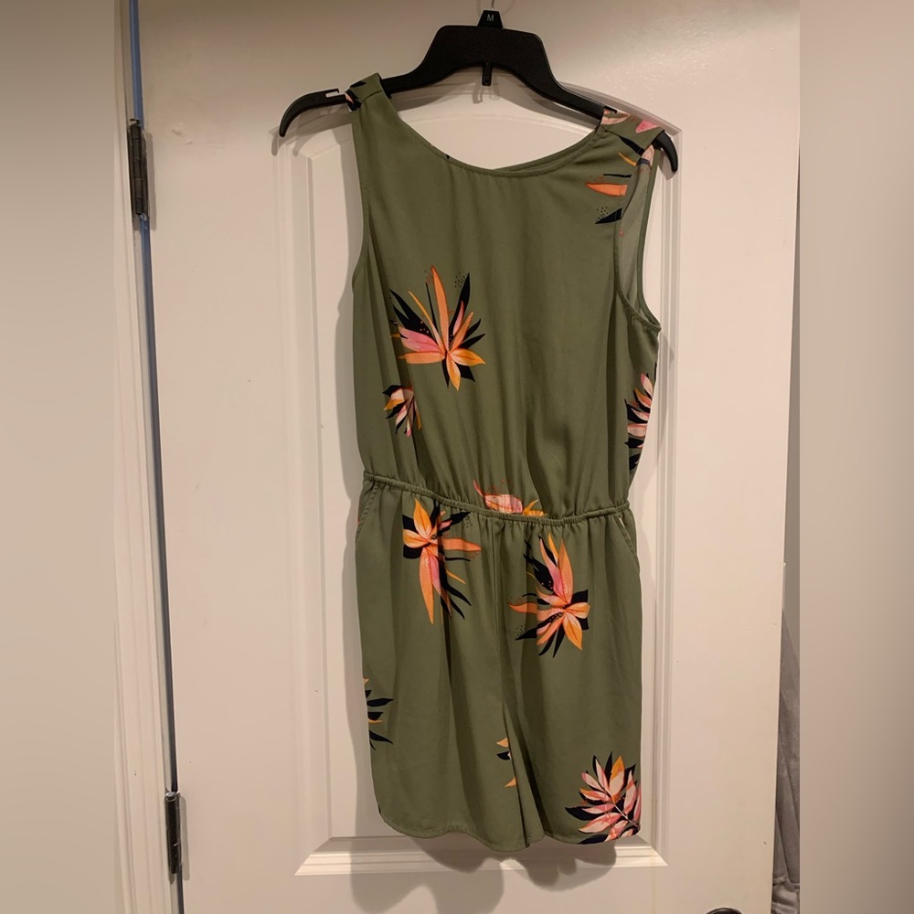 A new day olive green floral romper with an open back. Worn once.